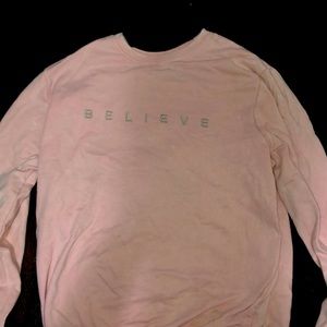 light pink believe sweatshirt